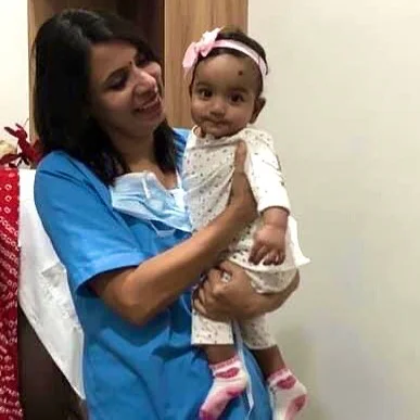 home 6 Doctor with baby girl